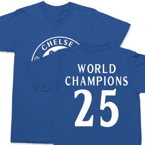 A blue t-shirt with the text "CHELSEA WORLD CHAMPIONS 25" printed on it.