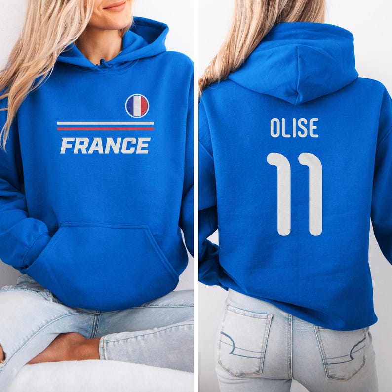 A woman wearing a blue hoodie with the word "FRANCE" printed on it, and the number "11" printed below it.