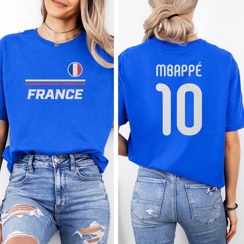 A woman wearing a blue t-shirt with the word "FRANCE" and the number 10 on the back, along with a French flag design.