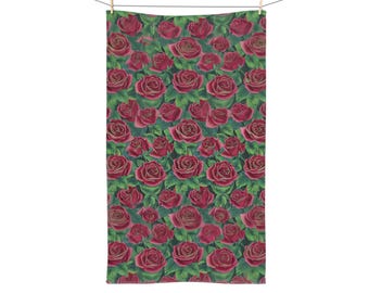 Toalla de mano con rosas rojas y estampado floral único.