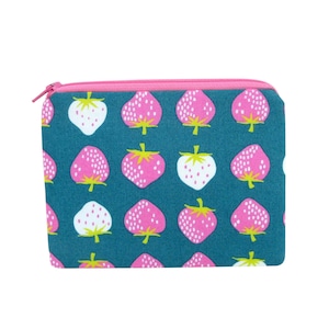 May include: A teal zippered pouch with a repeating pattern of pink and white strawberries. The zipper is pink, and the strawberries have green stems and leaves. The pouch is rectangular and likely made of fabric.