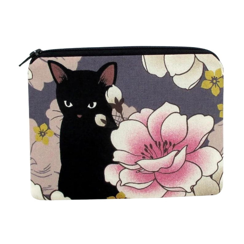May include: A black cat with a pink flower behind it on a gray and floral patterned zippered pouch.