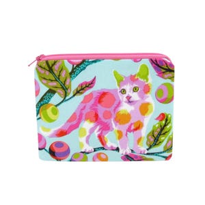 May include: A square, zippered pouch with a colorful cat design. The cat is pink with orange and yellow spots, set against a light blue background with green leaves and colorful orbs. The zipper is pink.