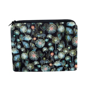 May include: Black zippered pouch with a floral pattern of white, blue, and pink dandelion-like flowers on a black background.