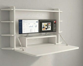 White wall-mounted folding table with triangular bookshelf