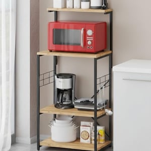 May include: A kitchen storage rack with a red microwave, coffee maker, and various kitchen items. The rack has a black metal frame and wooden shelves. The microwave is approximately 18 inches wide.