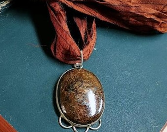 Hearthstone | Stunning Oval Bronzite set in sterling silver bezel on a pin striped vintage sari silk necklace.