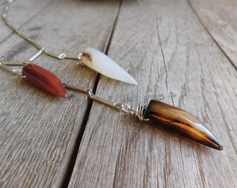 Venomous. Triple Talon Fringe Necklace. Red , white, & Smoky Agate claw talons on Silver texture bar chain