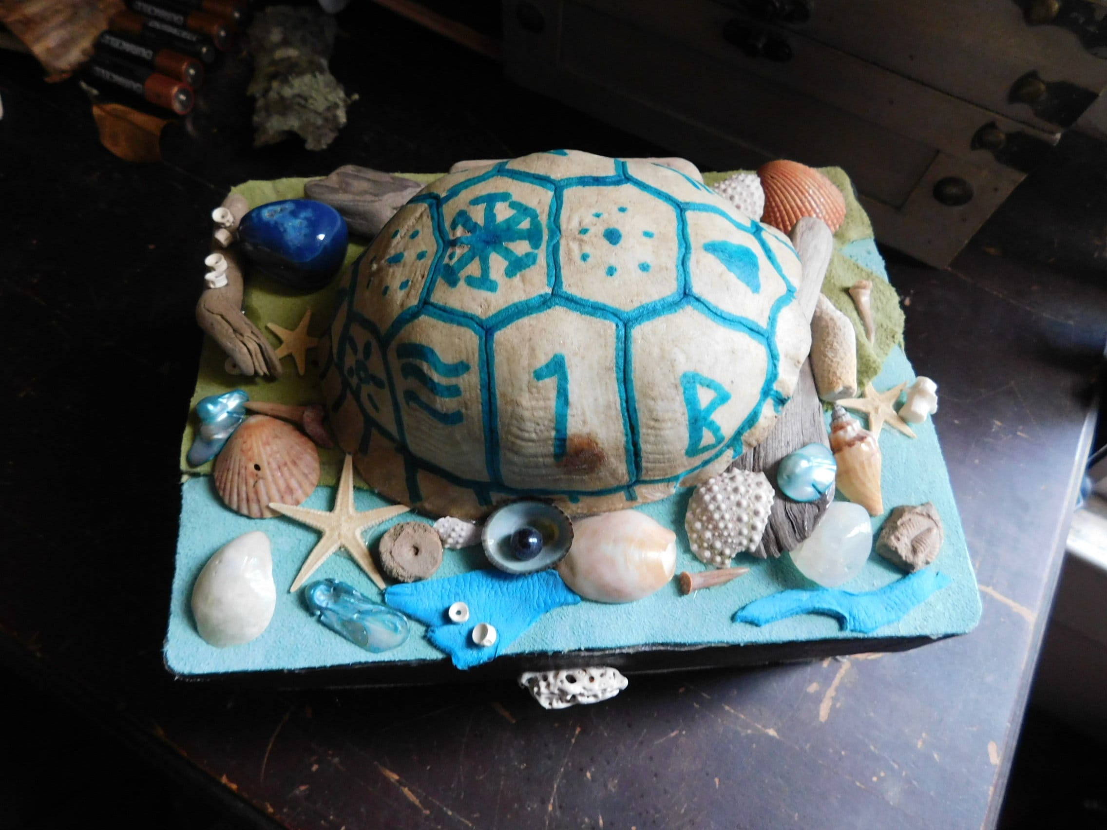 The Lyric Upcycled Musical Jewelry Box. Cloaked in leather, shells, shark vertebra, driftwood, shark teeth, faux turtle shell  & more