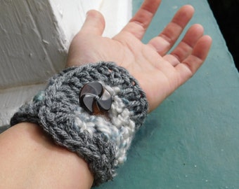 Moonstone Crocheted Cuff Bracelet. Moonstone Mottle Boucle & Heather Gray Yarn Cuff with Vintage Vegetable Ivory Mocha Brown swirl buttons