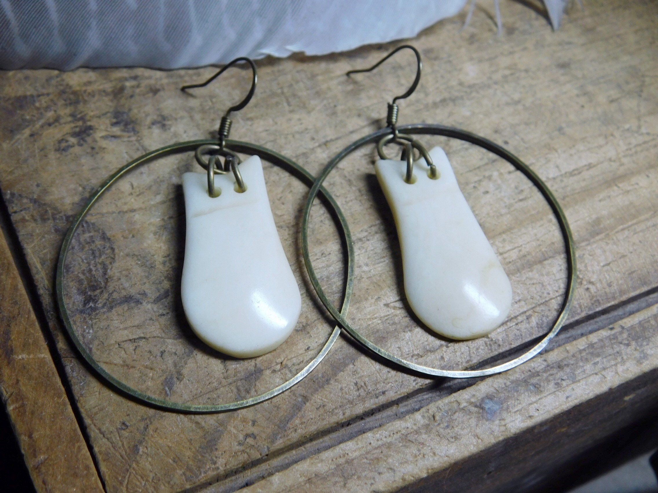 White Buffalo Roam. Huge antiqued brass hoop earrings, & carved white bison bone tongue shapes. Tribal, Totem, talismand boho earrings