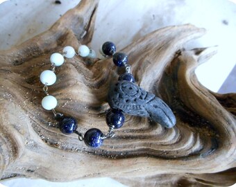 The Corvus Bracelet. Black Tribal Ceramic Raven Crow Head, Amazonite, & Midnight Blue Goldstone Beaded boho bracelet. Corvus Constellation