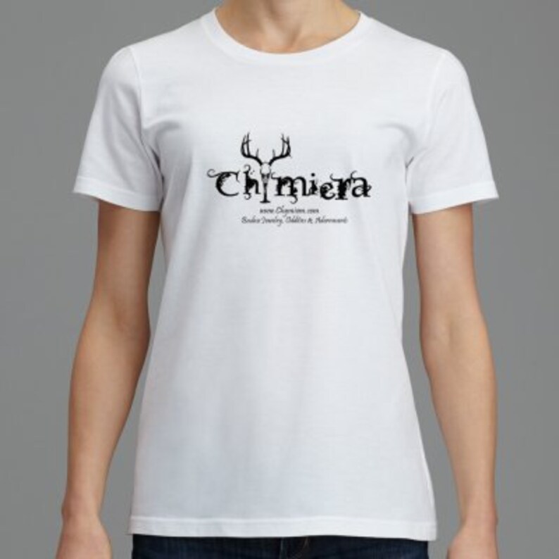 May include: White t-shirt with a black graphic of a deer skull and the text "Chimiera" with the website address "www.Chimiera.com" and the text "Saddle Jewelry, Saddles & Accessories".