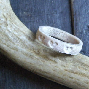 The Heartsmere Deer Antler Ring.  Handmade hand carved triple heart deer antler ring. Made to order in any size  By Chymiera