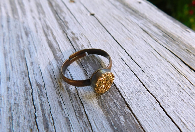 The Gilded Druzy Ring Gold Druzy Titanium Coated Crystal Cabochon ring.