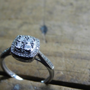 Genuine Diamond Engagement ring .20 TCW Real Diamond ring. Sterling silver, Quad Diamond, Empire setting & diamonds on band. Infinity symbol