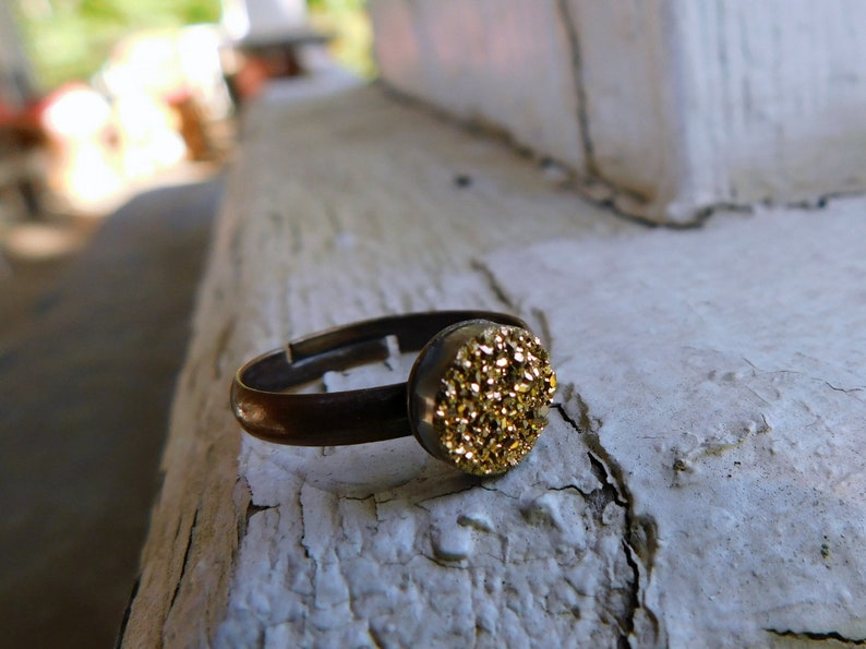 The Gilded Druzy Ring Gold Druzy Titanium Coated Crystal Cabochon ring.