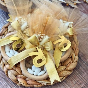 Elegant Italian bomboniere favor for milestone birthday, handmade with tulle bag, satin ribbon, dried flowers, and sugared almond candies — perfect 40th, 60th, or 80th birthday gift