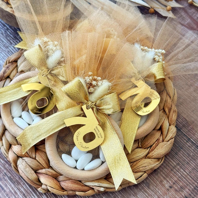 Elegant Italian bomboniere favor for milestone birthday, handmade with tulle bag, satin ribbon, dried flowers, and sugared almond candies — perfect 40th, 60th, or 80th birthday gift