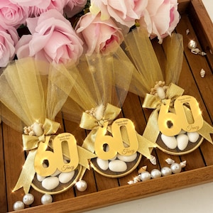 Beautiful birthday favor bag filled with almond candies, wrapped in elegant tulle and ribbon — perfect for milestone birthdays or party gifts