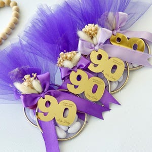 Custom Italian bomboniere favor — handmade with love, featuring tulle bag, sugared almonds, and personalized number charm for birthday celebration.