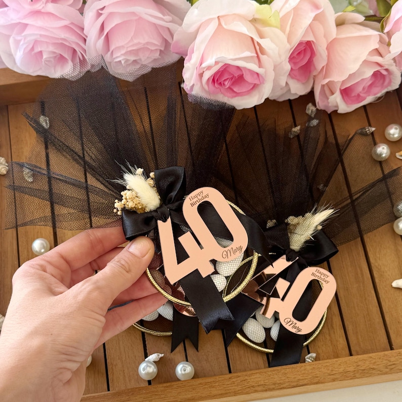 Elegant Italian bomboniere favor for milestone birthday, handmade with tulle bag, satin ribbon, dried flowers, and sugared almond candies — perfect 40th, 60th, or 80th birthday gift