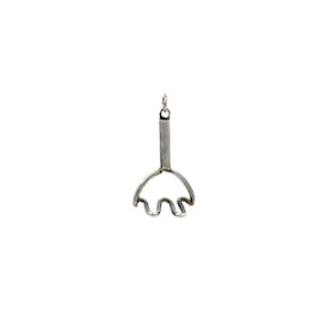 May include: A small, silver-colored charm or pendant. The design features a handle leading to a curved shape with three wavy lines. The charm has a loop at the top for attachment to a necklace or bracelet. The background is plain white.