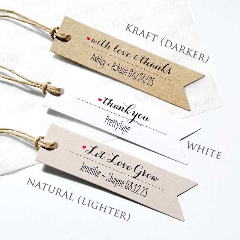 May include: Three different styles of wedding favor tags with twine. The tags are brown, white, and natural. The text on the tags reads "with love & thanks", "thank you", and "Let Love Grow".