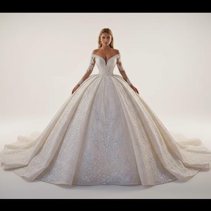 Luxurious Glitter Off-Shoulder Ball Gown Wedding Dress with Long Sleeves and Court Train