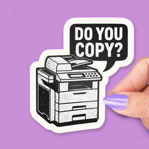 May include: A black and white sticker featuring a vintage-style copier with the text "DO YOU COPY?" in a speech bubble. The sticker is on a purple background.