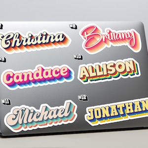 May include: A selection of name stickers in a retro style, featuring names such as "Christina," "Brittany," "Candace," "Allison," "Michael," and "Jonathan." Each sticker has a layered, colourful design with a shadow effect, ideal for personalising laptops.
