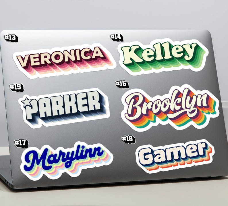 May include: A selection of retro-style name and word stickers displayed on a laptop. The stickers include names such as "Veronica," "Kelley," "Parker," "Brooklyn," "Marylinn," and the word "Gamer," each with distinct colours and 3D effects.
