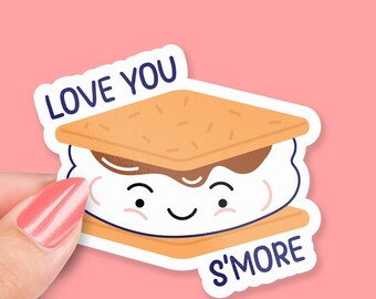 May include: A sticker with a cartoon s'more with a smiling face. The s'more has a graham cracker, marshmallow, and chocolate. The sticker says "Love You S'more".