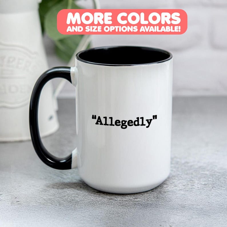 May include: White ceramic mug with a black interior and handle. The word "Allegedly" is printed in black on the front of the mug. A pink and white banner at the top reads "MORE COLORS AND SIZE OPTIONS AVAILABLE!"