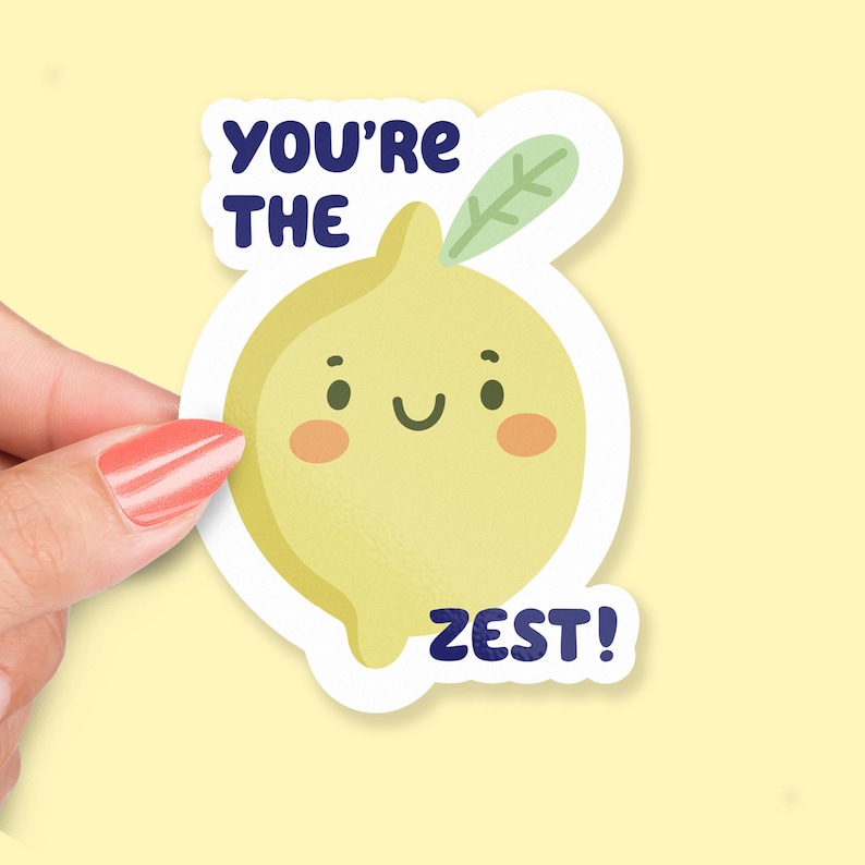 May include: A yellow lemon sticker with a smiling face and a green leaf. The sticker says "You're the Zest!"