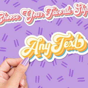 May include: Two retro-style stickers with the phrases "Choose Your Favourite Style" and "Any Text" in a layered, colourful design. The stickers are held by a hand against a purple background with a repeating pattern of short, vertical lines.