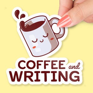 May include: A sticker featuring a cartoon coffee mug with closed eyes and a splash of coffee. The text "COFFEE and WRITING" is below the mug in a dark red font. The sticker is held by a hand against a yellow background.