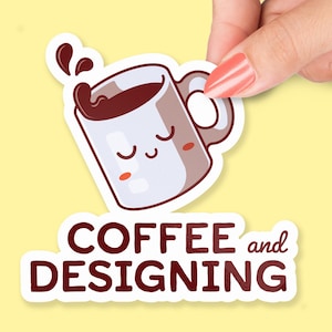 May include: A white coffee mug with a brown rim and a cute cartoon face. The mug is filled with brown coffee and has a steam coming out of it. The text "COFFEE and DESIGNING" is below the mug.