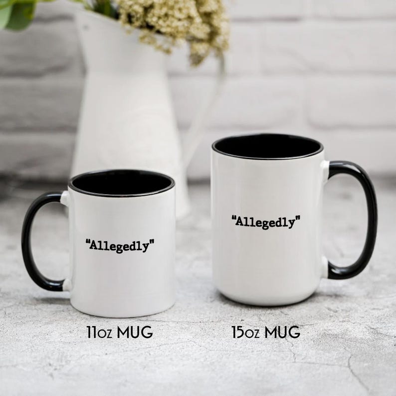 May include: Two white ceramic mugs with black interiors and handles. The mugs have the word "Allegedly" printed in black. One mug is labeled "11oz MUG" and the other is labeled "15oz MUG".