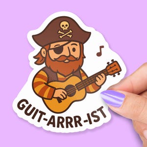 May include: A sticker featuring a cartoon pirate playing a ukulele. The pirate has a brown hat with a skull and crossbones, an eye patch, and a red beard. The sticker reads "GUIT-ARRR-IST".