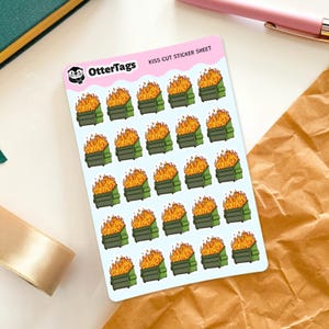 May include: A sheet of kiss-cut stickers featuring a repeating pattern of green dumpsters engulfed in flames. The stickers have a light blue background and the text "KISS CUT STICKER SHEET". The OtterTags logo is in the upper left corner.
