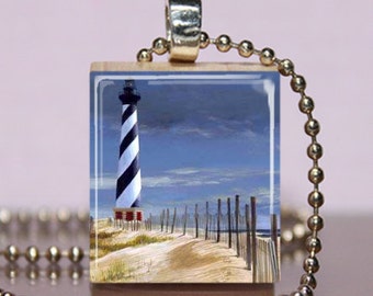 Lighthouse Ocean Pendant Walk on a Sandy Beach