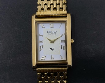 Raro orologio da polso da uomo Seiko Slim Vintage al quarzo con quadrante bianco - SPEDIZIONE GRATUITA