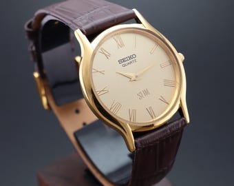 Zeldzaam rond vintage Seiko slank quartz herenpolshorloge – GRATIS VERZENDING