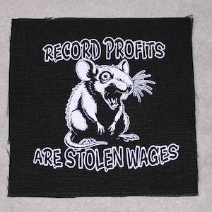 May include: Black and white patch with a cartoon rat and the text "Record Profits Are Stolen Wages".