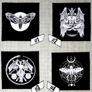 May include: Four black iron-on patches with white designs. The first patch features a moth with spread wings. The second patch features a winged demon figure in a seated pose. The third patch features a winged figure with a pentagram and a snake. The fourth patch features a moth with spread wings inside a circle with a crescent moon and stars.