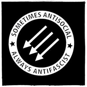 May include: Black and white circular patch with the text "Sometimes Antisocial Always Anti-Fascist" and three white arrows pointing to the right.