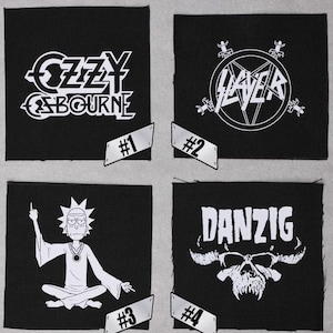 May include: Four black fabric patches with white text and graphics. The patches feature the band names "Ozzy Osbourne", "Slayer", "Danzig", and a cartoon character. The patches are numbered 1 through 4.