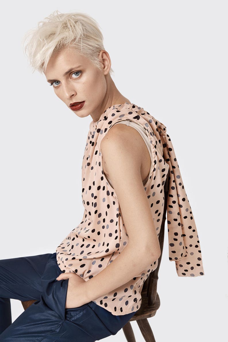 beige polka dot top