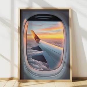 Könnte beinhalten: Ein Blick aus dem Flugzeugfenster, der einen Flügel vor dem Hintergrund von Wolken und einem farbenfrohen Sonnenuntergang zeigt.